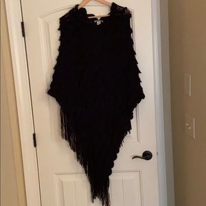 Black knit poncho with fringe